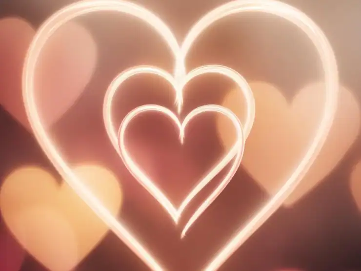 Ilustración de tres corazones de distintos tamaños, simbolizando las 3 Leyes del Amor de Bert Hellinger.
